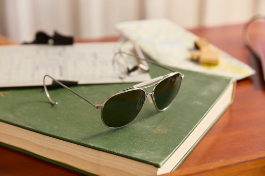 aviator sunglasses on a book