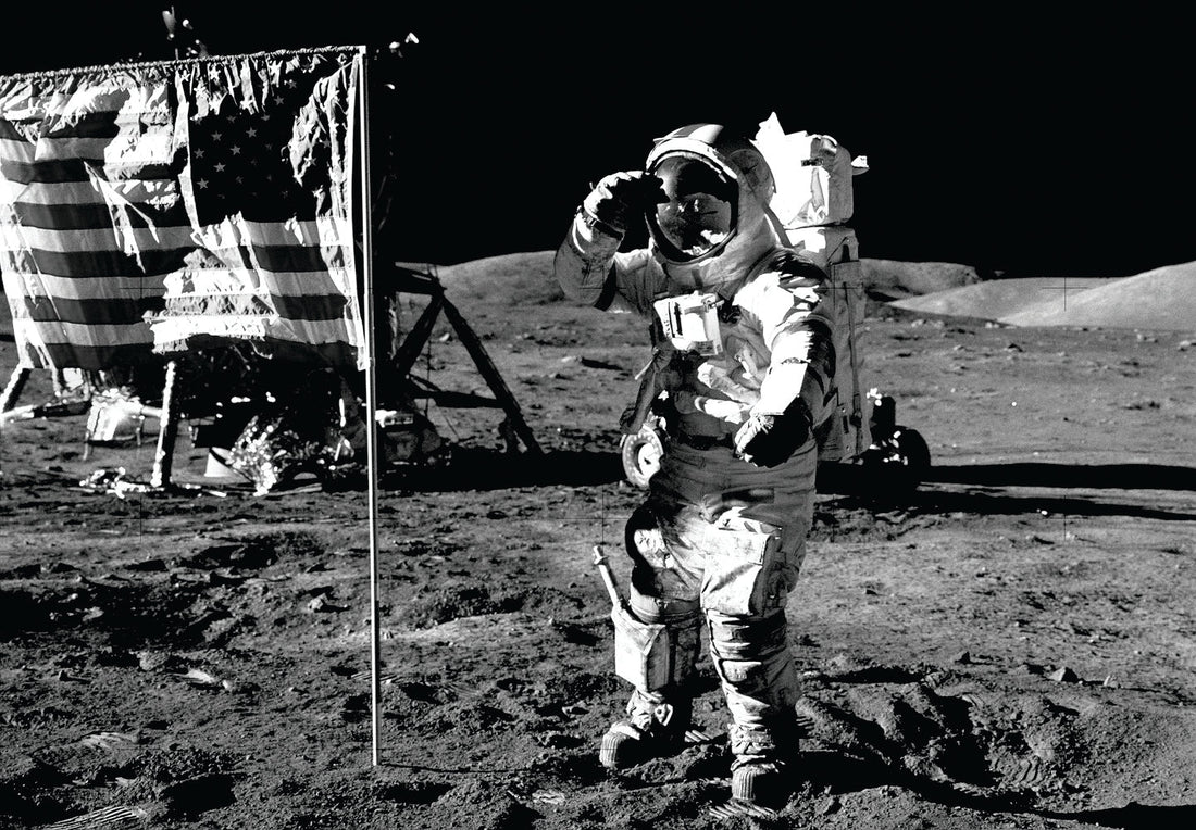 astronaut saluting the American flag on the moon
