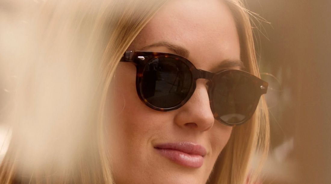 close up of a blonde woman in tortoise shell sunglasses
